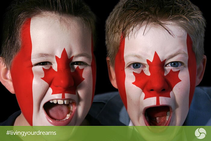 Two boys with Canadian flag face paint
