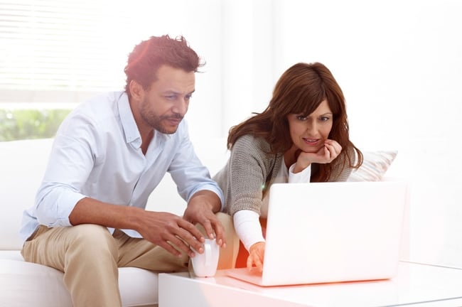 Couple looking at laptop