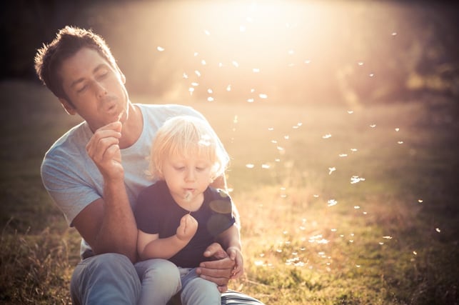Father and Child Blowing Bubbles