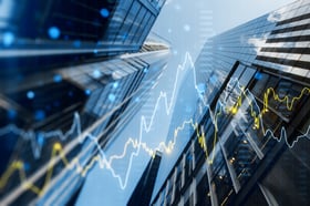 Skyscrapers with graph lines overlaying on top.
