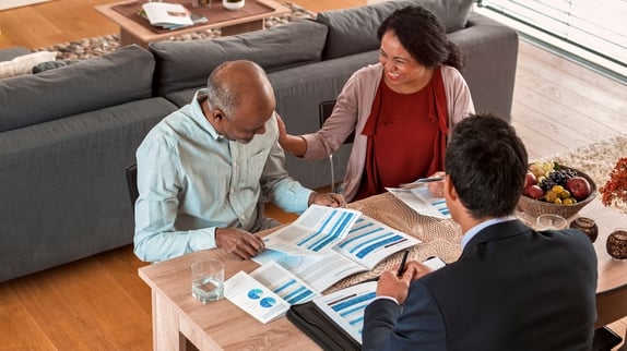 Couple planning with financial advisor. 