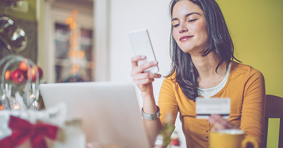 Young woman online holiday shopping